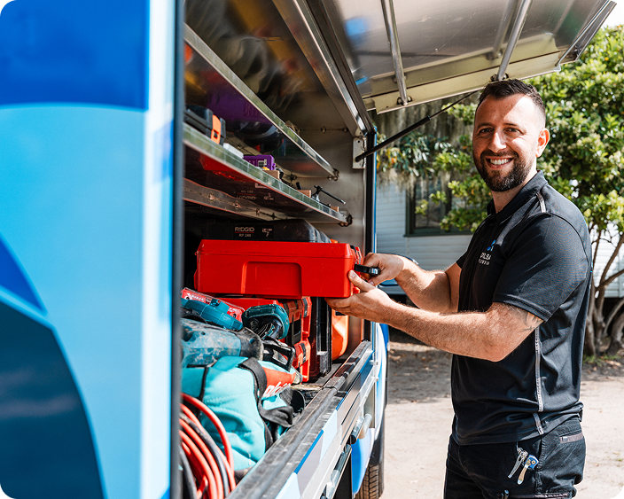 DYLSAL plumber loading parts from a fully-stocked van for an emergency burst pipe repair